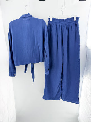 Mango two-piece set crafted from lightweight textured cotton featuring button-down long sleeve top with soft collar and tie-front detail paired with matching high-waisted pants, S