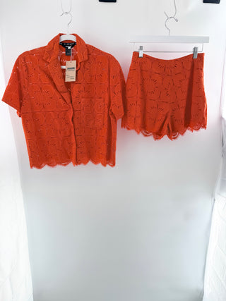 desigual two-piece set featuring intricate floral eyelet embroidery, top is short-sleeve button-front blouse with matching mini shorts, S