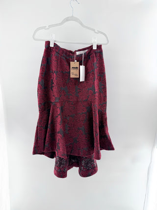 rachel parcel floral jacquard skirt featuring structured high-waisted fit with flared ruffle hem and high-low length, 10