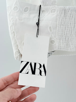 Zara embroidered eyelet set featuring structured corset-style crop top and flowy midi skirt with delicate broderie detailing, XS