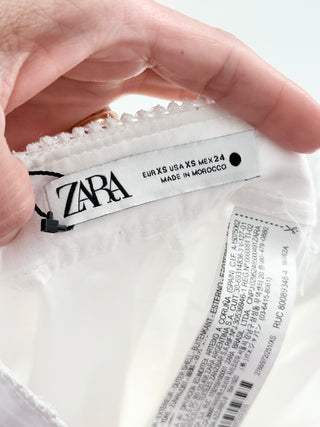 Zara embroidered eyelet set featuring structured corset-style crop top and flowy midi skirt with delicate broderie detailing, XS