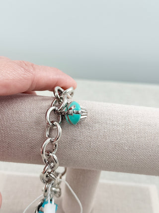 Tiffany & Co. sterling silver charm bracelet blue enamel present and green enamel cupcake charms