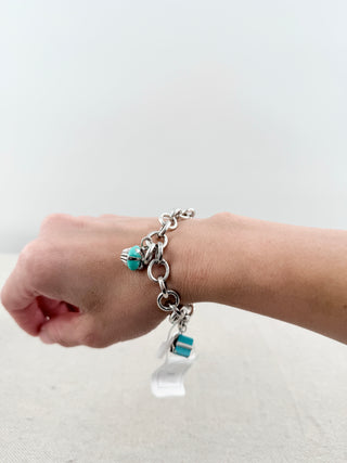 Tiffany & Co. sterling silver charm bracelet blue enamel present and green enamel cupcake charms