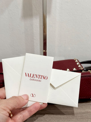 Valentino Garavani Pebbled Calfskin Medium Rockstud Flip Lock Crossbody Bag burgundy