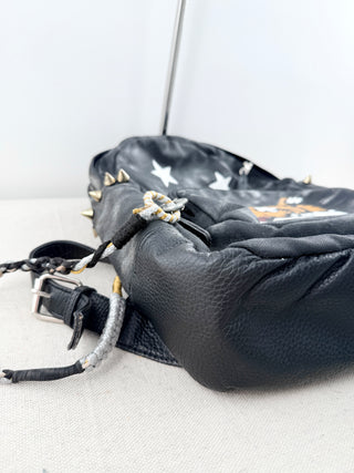 queen b faux leather mini backpack featuring bold tiger graphic on front pocket and stud detailing, designed with top handle, adjustable shoulder straps