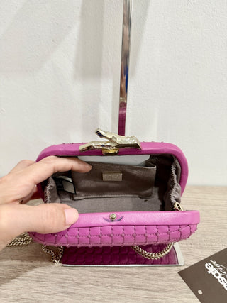 Diane von Furstenberg leather clutch with gold hardware