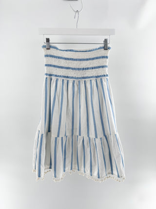 Milly striped skirt featuring smocked waistband, tiered silhouette, and pom-pom trim in lightweight cotton fabric, S