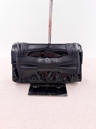 Valentino patent leather clutch bag with leather bow
