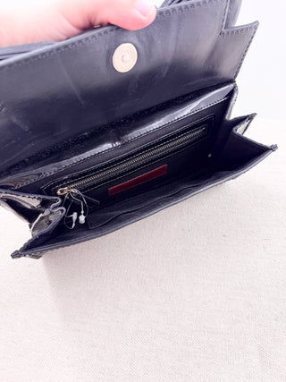 Valentino patent leather clutch bag with leather bow