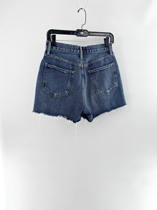 Agolde high-rise denim shorts featuring vintage wash, distressed detailing, and frayed raw hem, 27