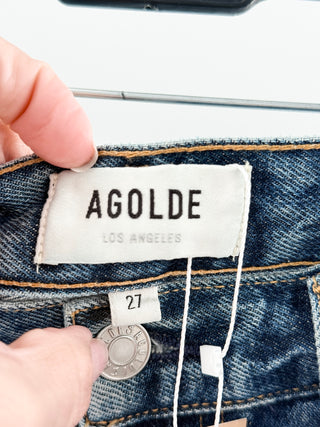 Agolde high-rise denim shorts featuring vintage wash, distressed detailing, and frayed raw hem, 27